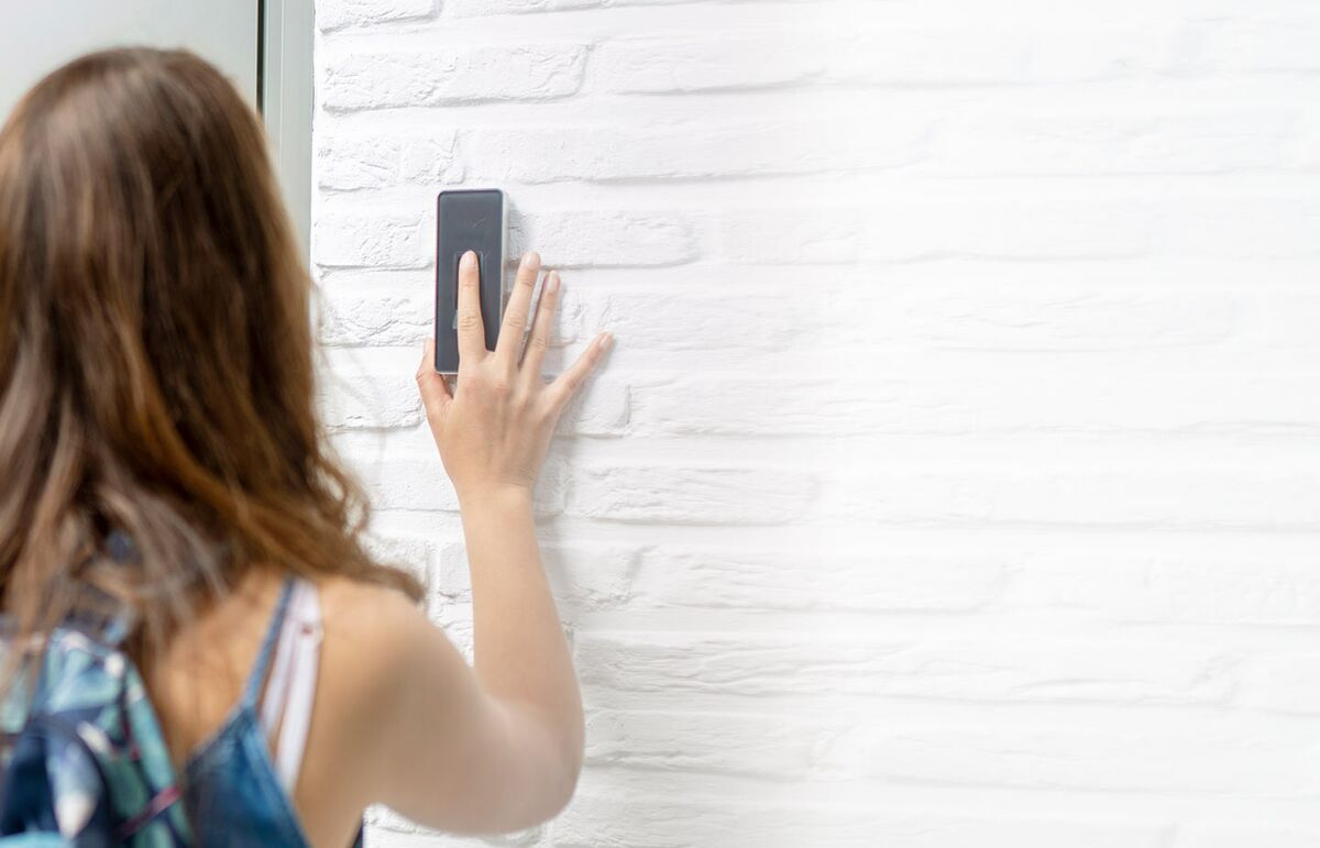 Girl entering white house via fingerprint scanner technology.